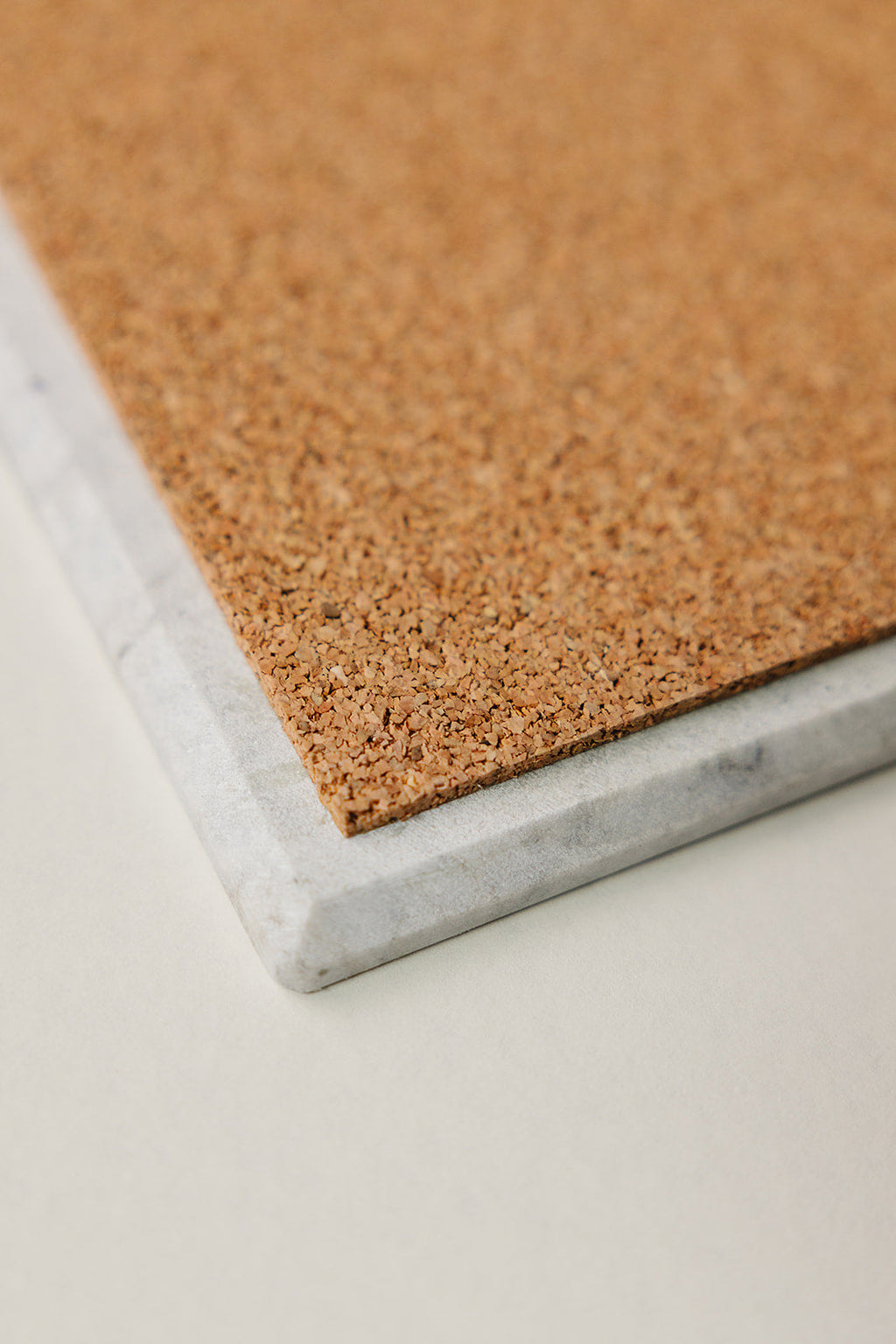 Cork-backed base of the Aleutian handcrafted marble charcuterie board to protect surfaces