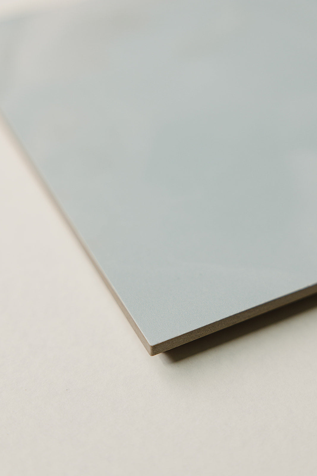 Beveled edge detail of the sage-green Verona Italian porcelain charcuterie board