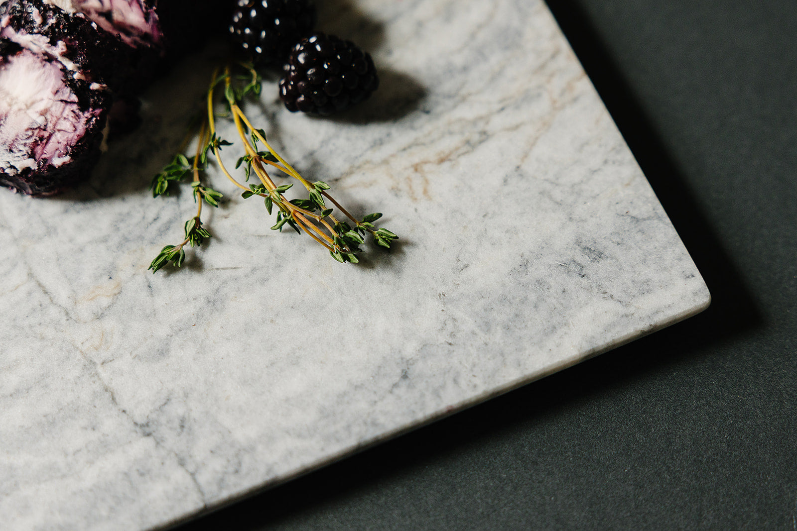 Aleutian marble charcuterie board styled with goat cheese for entertaining