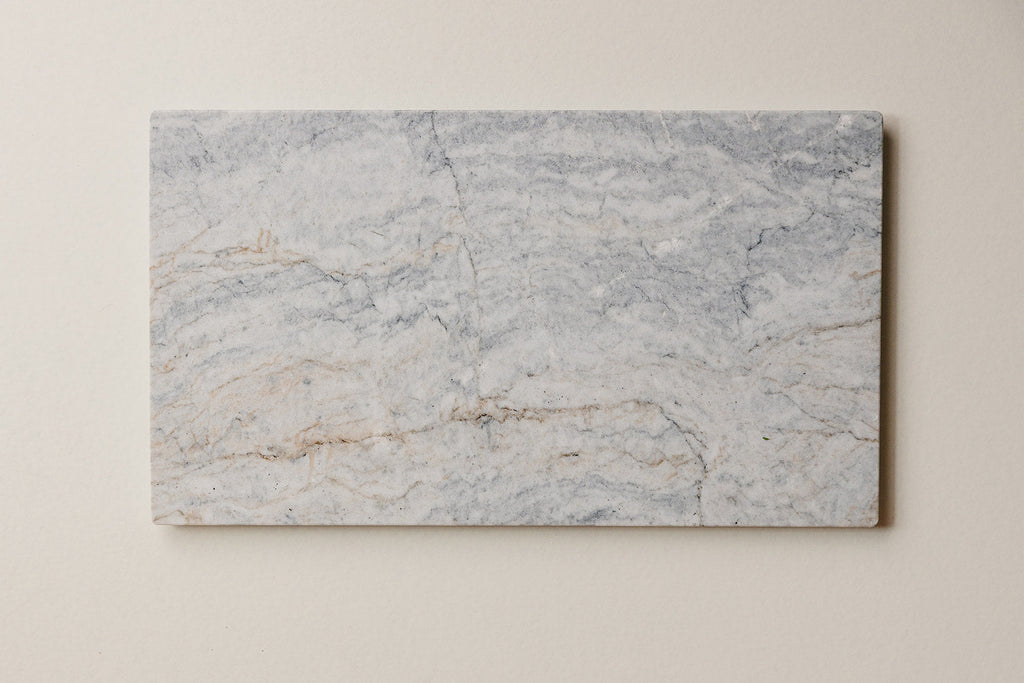Aleutian handcrafted marble charcuterie board with natural veining and cork back - That Grazing Table