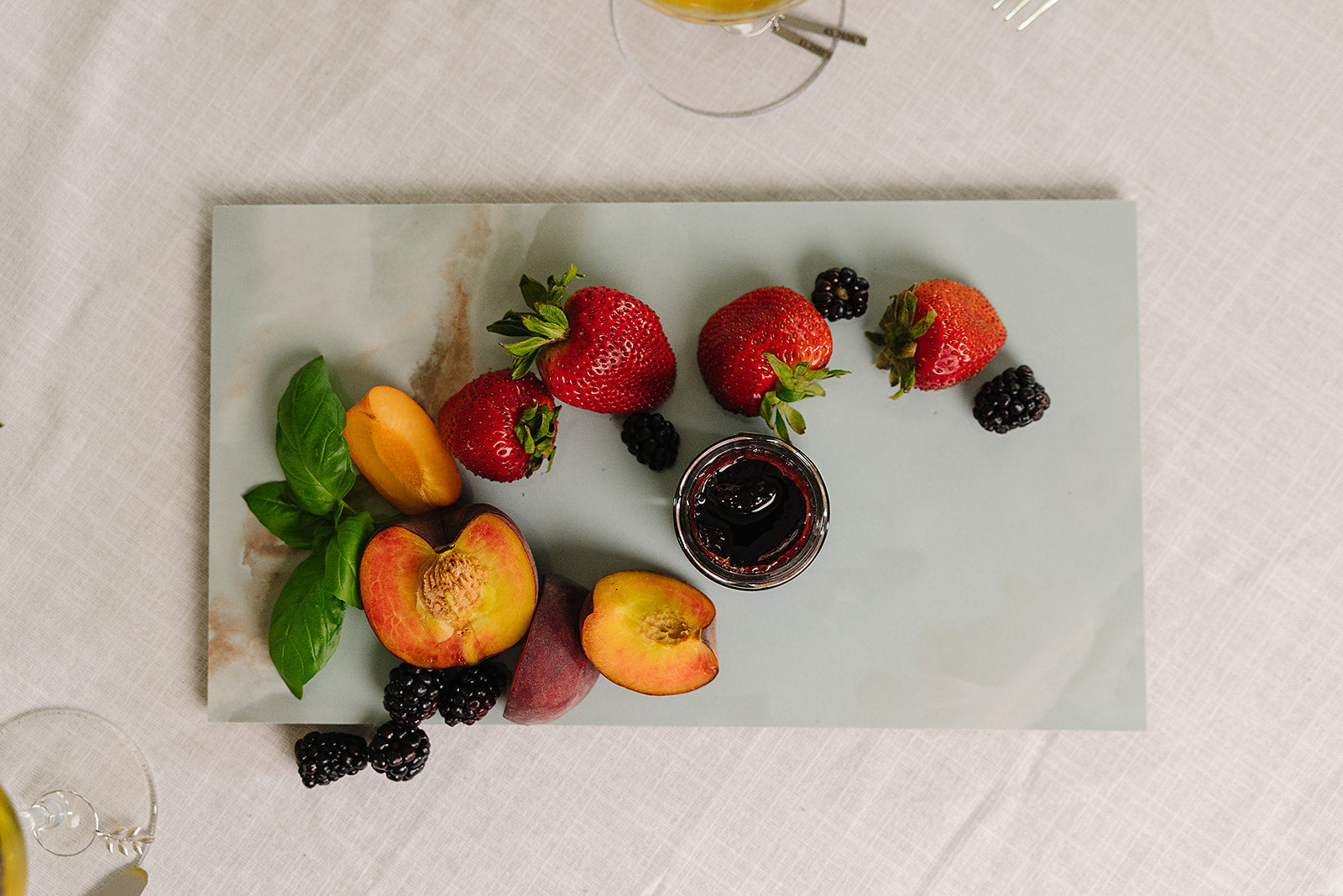 Verona Italian porcelain charcuterie board styled on a dinner table for hosting