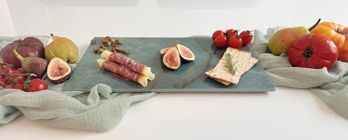Olive green Sevilla porcelain charcuterie gift set with warm amber veining, artisan preserves, wine charms, and a keepsake gift box