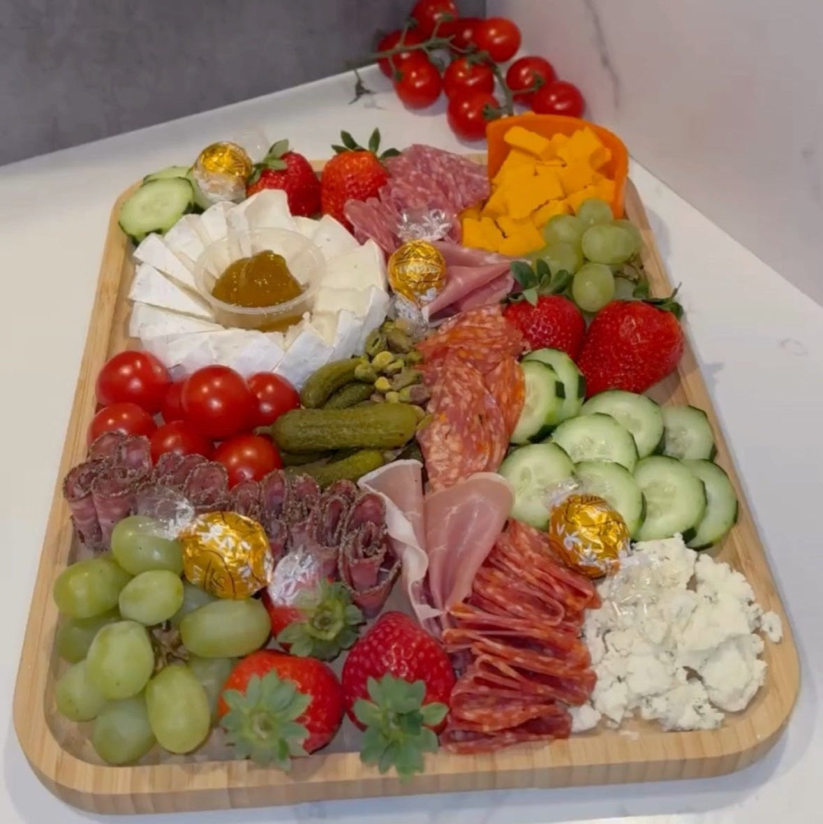 Bamboo charcuterie board with lid. Great for picnics, pool days, and entertaining at home. 